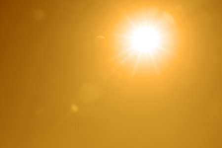 Bright sun in orange sky during hot summer weather. Extremely high temperatureの写真素材