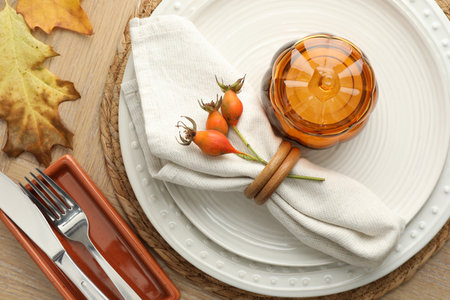 Beautiful table setting with autumn decor on wooden background, flat layの写真素材