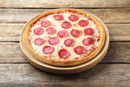 Delicious pepperoni pizza on wooden table, closeupの写真素材