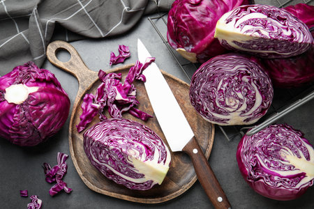 Fresh red cabbages and knife on gray table, flat layの写真素材