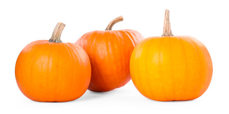 Three whole ripe pumpkins isolated on whiteの写真素材