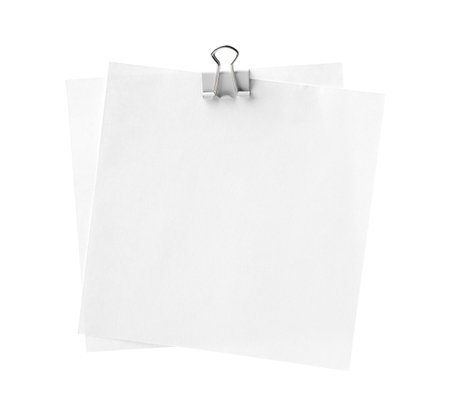 Blank paper notes attached with blinder clip isolated on whiteの写真素材