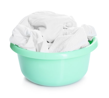 Plastic basin with laundry isolated on whiteの写真素材