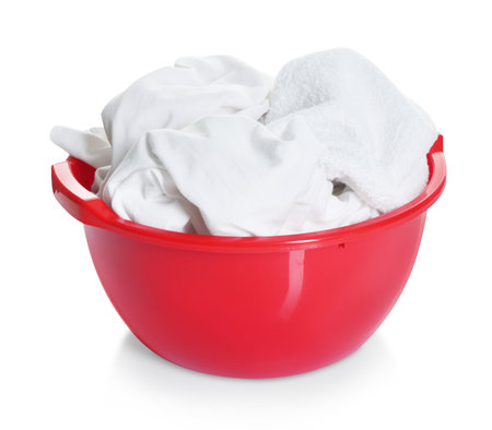 Plastic basin with laundry isolated on whiteの写真素材