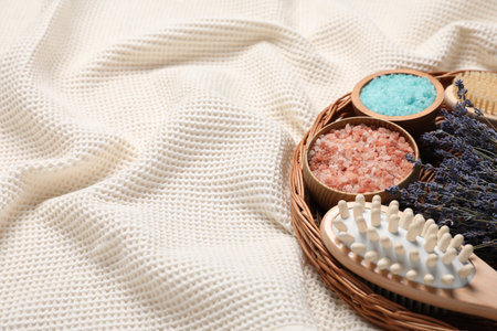 Beautiful composition with spa essentials on light fabric, closeup. Space for textの写真素材