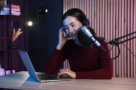 Podcast host recording talk show in studioの写真素材