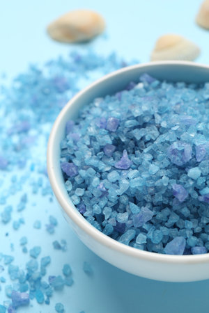 Sea salt on light blue background, closeupの写真素材