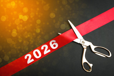 New 2026 Year poster design with scissors, red ribbon and bokeh lights