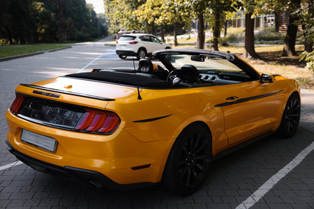 Modern cabriolet parked on parking lot outdoorsの写真素材