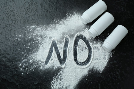 Word NO made of powder and containers on black background, flat layの写真素材