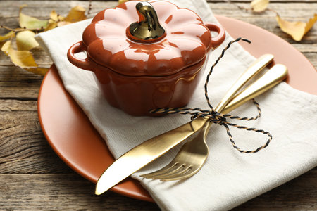 Beautiful table setting with autumn decor on wooden background, closeupの写真素材