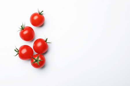 Fresh ripe tomatoes on white background, flat layの写真素材