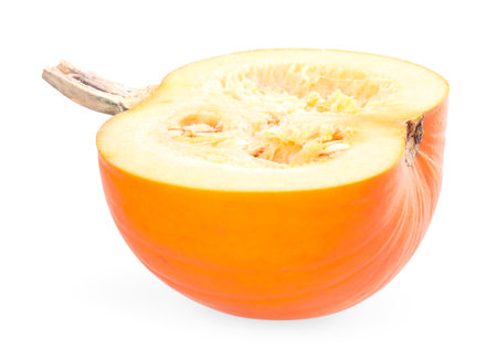 Half of ripe pumpkin with seeds isolated on whiteの写真素材