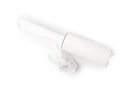 Lint roller with used sticky tape isolated on white, top viewの写真素材