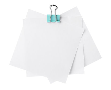 Blank paper notes attached with blinder clip isolated on whiteの写真素材