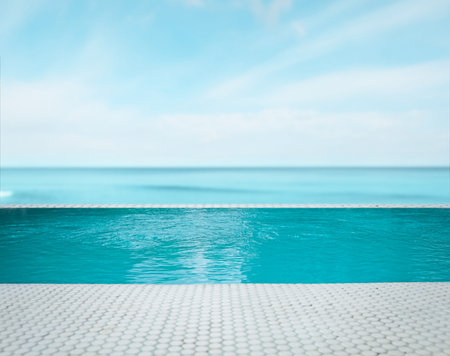 Swimming pool with clear water and infinity view on oceanの写真素材