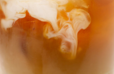 Tasty iced coffee in glass as background, closeupの写真素材