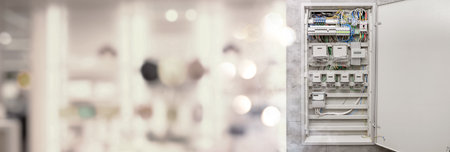 Fuse box with many electric meters and wires indoors. Banner designの写真素材