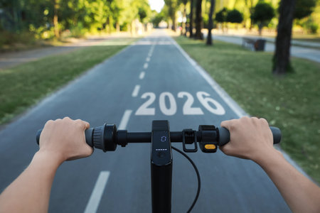 Riding towards numbers on asphalt road, view from cyclistの写真素材