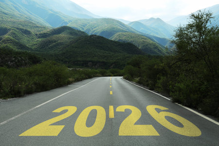 Yellow written numbers on asphalt road in mountains