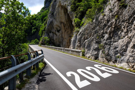 Numbers written on asphalt road in mountains