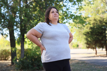 Woman posing in park, low angle viewの写真素材