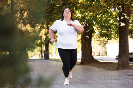 Woman running in park. Healthy lifestyle