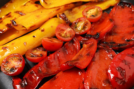 Tasty grilled vegetables in black pan, closeupの写真素材