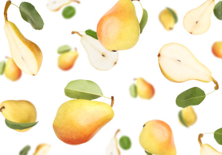 Fresh pears and green leaves falling on white backgroundの写真素材