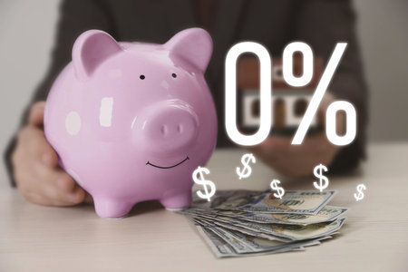 Zero commission. Woman holding piggy bank and model of house at table with money, closeup. 0 percent...