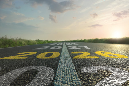 Numbers written on asphalt road, closeup