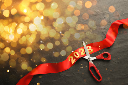 New 2026 Year poster design with scissors, red ribbon and bokeh lightsの写真素材