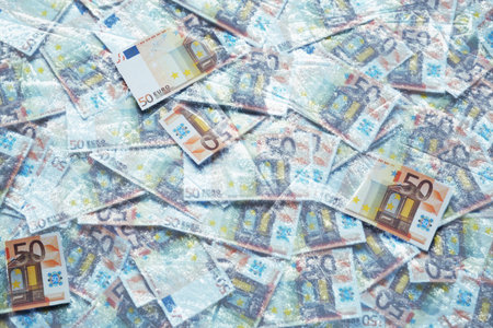 Money under ice. Many euro bills frozen