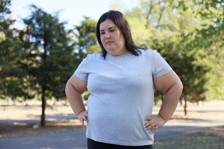 Portrait of woman posing in parkの写真素材