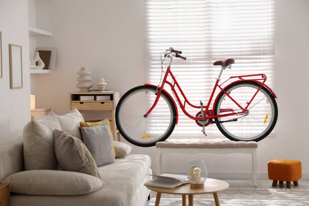 Red bicycle, sofa and decor in roomの写真素材