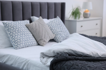 Beautiful room with comfortable bed, closeup. Interior designの写真素材