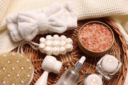 Beautiful composition with spa essentials on light fabric, closeupの写真素材