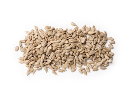 Pile of sunflower seeds isolated on whiteの写真素材
