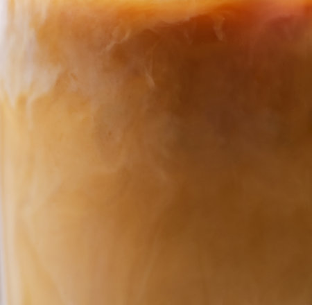 Tasty iced coffee in glass as background, closeupの写真素材