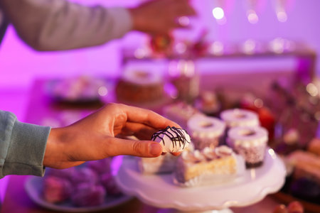 Buffet menu. Guest with delicious dessert at table, selective focusの写真素材