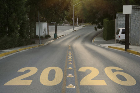 Yellow written numbers on asphalt road in cityの写真素材