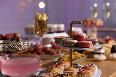 Buffet menu. Different delicious desserts on table, selective focus