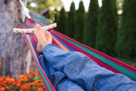 Senior woman resting in hammock outdoors, closeup