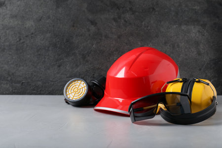 Different safety equipment on light table. Space for textの写真素材