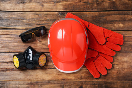 Different safety equipment on wooden table, flat layの写真素材