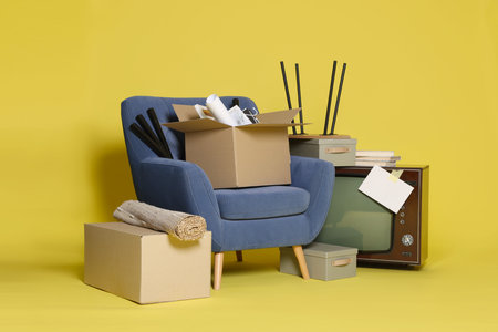 Garage sale. Different used stuff on yellow background
