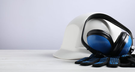 Different safety equipment on white wooden table. Space for textの写真素材