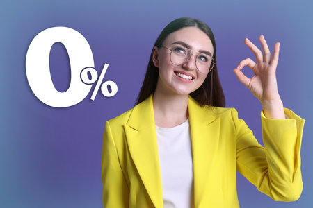 Happy woman showing ok sign on blue gradient background. 0 percent sign near herの写真素材