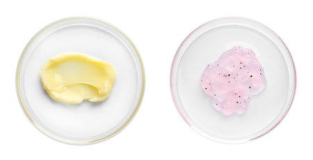 Petri dishes with cosmetic products on white background, top viewの写真素材