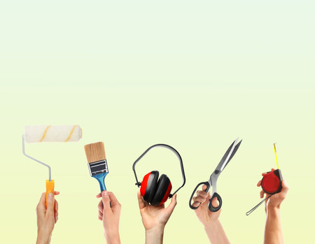People holding different tools in hands against color gradient background, closeup.の写真素材